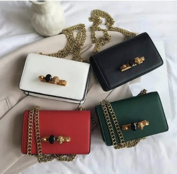 Green, red,black and white hand bags