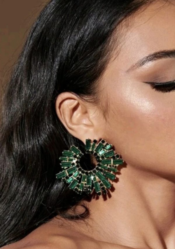 Green earring.